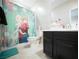 Bathroom featuring vanity with drawers, a sink and 'Frozen' themed shower curtain at 4465 Shimmering Skies St # 2180, North Las Vegas, NV 89031