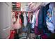 Walk-in closet with an array of clothing and shoe boxes, maximizing storage at 4465 Shimmering Skies St # 2180, North Las Vegas, NV 89031