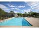 Sparkling community pool with plenty of seating for residents to relax and enjoy the sun at 4465 Shimmering Skies St # 2180, North Las Vegas, NV 89031