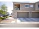 Modern two-story townhome with a private balcony, garage, and well-maintained landscaping at 4465 Shimmering Skies St # 2180, North Las Vegas, NV 89031