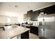 Bright kitchen with stainless steel appliances, granite counters and center island at 4465 Shimmering Skies St # 2180, North Las Vegas, NV 89031