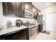 Close up on gas cooktop, stainless appliances and granite counters at 4465 Shimmering Skies St # 2180, North Las Vegas, NV 89031