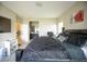 Spacious primary bedroom with a view into the ensuite bathroom, a large bed, and modern decor at 4465 Shimmering Skies St # 2180, North Las Vegas, NV 89031