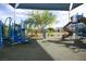 Colorful playground featuring slides, climbing structures, and sun shade at 4465 Shimmering Skies St # 2180, North Las Vegas, NV 89031