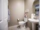 Compact powder room featuring a pedestal sink and tiled floor at 4465 Shimmering Skies St # 2180, North Las Vegas, NV 89031