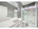 Modern bathroom with stylish vanity and marble tiled shower at 4504 Dunlap Crossing St, Las Vegas, NV 89129