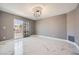 A large, light-filled bedroom features marble floors, recessed lights, and a modern chandelier at 4504 Dunlap Crossing St, Las Vegas, NV 89129