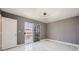This bedroom features marble floors, modern lighting, and a sliding glass door to a balcony at 4504 Dunlap Crossing St, Las Vegas, NV 89129