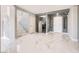 Spacious foyer with marble floors, staircase, and gray accent walls at 4504 Dunlap Crossing St, Las Vegas, NV 89129