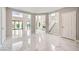 Bright foyer with marble flooring and stairs leading to the second level at 4504 Dunlap Crossing St, Las Vegas, NV 89129