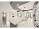 Bright kitchen with island, marble counters, modern appliances, and pendant lights at 4504 Dunlap Crossing St, Las Vegas, NV 89129