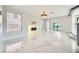 Bright and airy living room features marble floors, a contemporary fireplace, and ample natural light at 4504 Dunlap Crossing St, Las Vegas, NV 89129