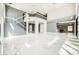 Open living area with marble flooring, high ceilings, and gray accent walls at 4504 Dunlap Crossing St, Las Vegas, NV 89129