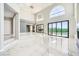 Large living area with marble flooring, recessed lights, and back yard views at 4504 Dunlap Crossing St, Las Vegas, NV 89129