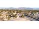 An aerial view of the home, neighborhood, and a mountain range in the distance at 5193 N Miller Ln, Las Vegas, NV 89149