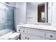 Well-maintained bathroom featuring a shower-tub combo and classic white vanity at 5193 N Miller Ln, Las Vegas, NV 89149