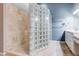 Elegant bathroom showcasing a glass block shower, double vanity, and modern fixtures at 5193 N Miller Ln, Las Vegas, NV 89149