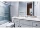 Well-maintained bathroom featuring a shower-tub combo and classic white vanity at 5193 N Miller Ln, Las Vegas, NV 89149