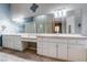 Bathroom featuring double vanity sinks, tile countertops, and neutral color scheme at 5193 N Miller Ln, Las Vegas, NV 89149