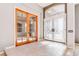 Open foyer features tile flooring and a clear view of the glass French doors and exterior entrance at 5193 N Miller Ln, Las Vegas, NV 89149