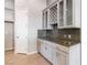 Eat-in kitchen with neutral color scheme, granite countertops, and storage at 5193 N Miller Ln, Las Vegas, NV 89149