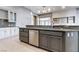 Kitchen island features a dishwasher and stainless steel sink with a neutral color scheme at 5193 N Miller Ln, Las Vegas, NV 89149