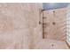 Luxurious walk-in shower featuring designer tile, dual shower heads, and built-in shelving at 5193 N Miller Ln, Las Vegas, NV 89149