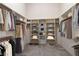 Spacious walk-in closet with ample shelving, hanging space, and organized storage solutions at 5193 N Miller Ln, Las Vegas, NV 89149
