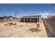 Spacious backyard with a covered patio and fire pit offers outdoor living and entertainment at 5463 Waltham Ln, Las Vegas, NV 89122