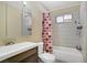 Well-lit bathroom with a shower-tub combo and modern vanity at 5463 Waltham Ln, Las Vegas, NV 89122