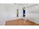 Bright bedroom with laminate flooring, closet, and ample shelving provides space and convenience at 5463 Waltham Ln, Las Vegas, NV 89122