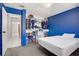 Bedroom with open closet space and natural light from a large window at 5463 Waltham Ln, Las Vegas, NV 89122