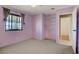 Bedroom featuring carpet floors, a window, and open closet space at 5463 Waltham Ln, Las Vegas, NV 89122