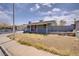 Charming one-story home with solar panels, a covered porch, and desert landscaping presents curb appeal at 5463 Waltham Ln, Las Vegas, NV 89122