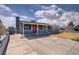 Charming single-story home with gray exterior, front porch, and a spacious concrete driveway at 5463 Waltham Ln, Las Vegas, NV 89122