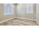 Bedroom featuring shutters on the windows, offering privacy and light control, along with neutral decor and trim at 5790 Douglas Everett St, Las Vegas, NV 89120