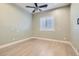 Bright bedroom with recessed lighting, light-tone floors, and window with white shutters at 5790 Douglas Everett St, Las Vegas, NV 89120