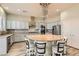 Stunning kitchen featuring a large island with seating, stainless steel appliances, and elegant gray cabinetry at 5790 Douglas Everett St, Las Vegas, NV 89120
