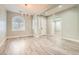 Elegant open space featuring modern lighting, sleek flooring, and large windows allowing ample natural light at 5790 Douglas Everett St, Las Vegas, NV 89120