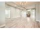 Open-concept living area with neutral tones, modern recessed lighting, and an easy flow to other living spaces at 5790 Douglas Everett St, Las Vegas, NV 89120