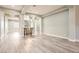 Spacious living area with sleek flooring, a stylish bar area, recessed lighting, and an open-concept design at 5790 Douglas Everett St, Las Vegas, NV 89120