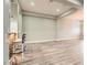 Bright living room showcasing a bar with modern stools, light wood floors, and neutral wall colors at 5790 Douglas Everett St, Las Vegas, NV 89120