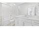 A modern bathroom with white cabinets, tile backsplash and shower at 600 N Carriage Hill Dr # 2098, Las Vegas, NV 89138