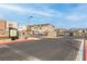 Gated community entrance featuring landscaping and signage for a secure and welcoming entry at 600 N Carriage Hill Dr # 2098, Las Vegas, NV 89138