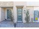 Stylish townhome entrance with modern blue door and stone accents at 600 N Carriage Hill Dr # 2098, Las Vegas, NV 89138