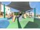Community playground featuring shaded play structures with slides and climbing features for outdoor fun at 600 N Carriage Hill Dr # 2098, Las Vegas, NV 89138