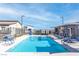 A Community pool featuring clear blue water and lounge seating at 600 N Carriage Hill Dr # 2098, Las Vegas, NV 89138