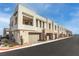 Modern townhome community with brick accents and attached garages at 600 N Carriage Hill Dr # 2098, Las Vegas, NV 89138