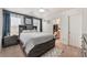 Bedroom with a bed featuring built-in shelving and carpeted floors at 6270 Dartington Hall St, Henderson, NV 89011