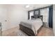 Bedroom with carpet flooring, built-in shelving, and ensuite bathroom access at 6270 Dartington Hall St, Henderson, NV 89011